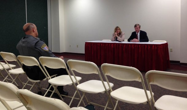 Bennington Police Chief Paul Doucette asks questions of gubernatorial candidates Emily Peyton and Scott Milne on Thursday in Essex Junction. Photo by Laura Krantz/VTDigger