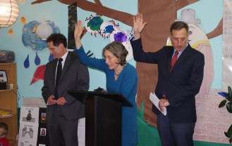 Secretary of Education Rebecca Holcombe asks how many children at Ira Allen School in Burlington like coming to school Thursday. With her is DCF Commissioner Ken Schatz (left) and Gov. Peter Shumlin. Photo by Tom Brown/VTDigger