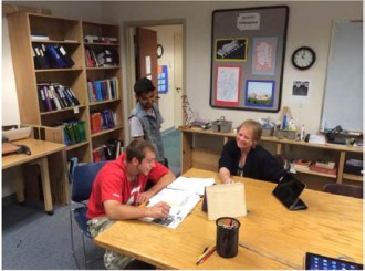 An instructor works with students at Community High School of Vermont. Courtesy photo