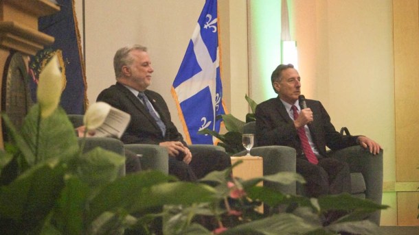 Quebec Premier Philippe Couillard and Gov. Peter Shumlin discuss the relationship between Vermont and Quebec during a dinner ceremony at a energy conference in Burlington on Monday. Photo by John Herrick/VTDigger