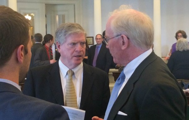 Sen. President Pro Tem John Campbell (center), D-Windsor, and Sen. Kevin Mullin, R-Rutland, confer on the Senate floor Friday. Photo by Erin Mansfield/VTDigger