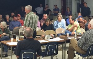 âGuy Rouelle, aviation program administrator for VTrans, takes questions  from concerned residents at the Middlebury State Airport in East Middlebury.  Photo by Erin Mansfield/VTDigger