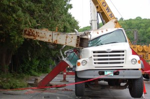 The crane truck from which an extension fell, landing on the Christ Episcopal Church in Montpelier and also damaging the truck. Photo by Amy Ash Nixon/VTDigger