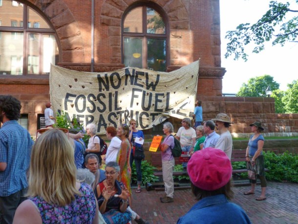 Demonstrators from Rising Tide Vermont and the Vermont Workers Center gather at the Public Service Board building in Montpelier. Photo by Erin Mansfield/VTDigger