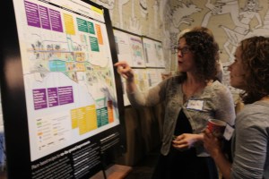 Amy Kohn, senior planner and associate at Goody Clancy, a Boston design firm tasked with developing PlanBTV, describes the plans to a community member. (Photo by Jess Wisloski)