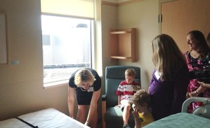 Nurse Manager Jennifer Robare demonstrates a folding Murphy bed — one of the new features found in each room of the new Mother Baby Unit at the University of Vermont Medical Center. Photo by Sam Heller/VTDigger