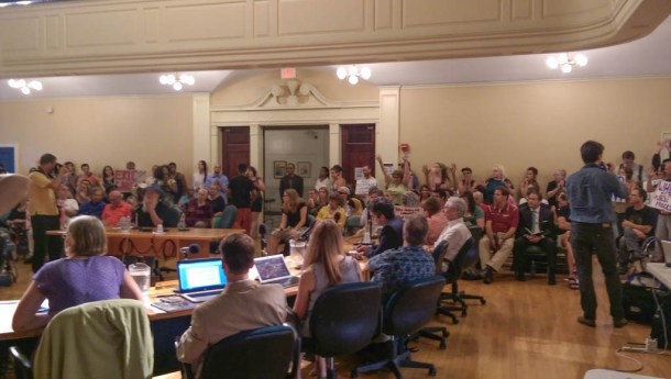 Contois Auditorium in Burlington City Hall is packed Monday for a City Council meeting to confirm NYPD Inspector Brandon del Pozo as the city's next police chief. Photo by Sarah Olsen/VTDigger