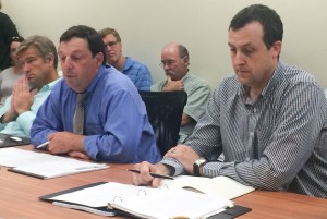 Department of Public Service Commissioner Chris Recchia (left) speks at a hearing on solar siting. Photo by Erin Mansfield/VTDigger