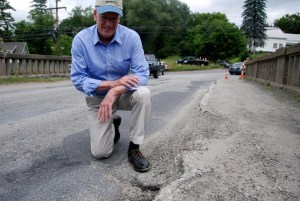 Rep. Peter Welch, D-Vt., observes damage on a bridge in East Montpelier. Photo by Elizabeth Hewitt/VTDigger
