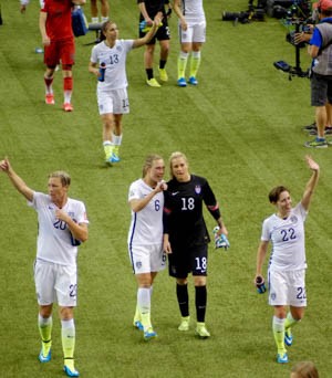 Members of the U.S. women's soccer team celebrate a World Cup match victory in Ottawa. Photo by Mark Bushnell