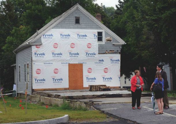 Barbara Farr, Waterbury’s long-term recovery director, talks outside a building that will be part of the Hunger Mountain Children’s Center. Photo by Gordon Miller/Waterbury Record