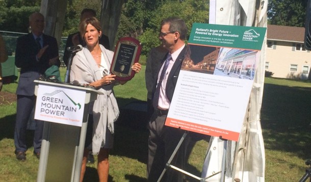 Rutland Mayor Christopher Louras accepts a declaration of his city as the Solar Capital of New England from Mary Powell, president and CEO of Green Mountain Power. Photo by Erin Mansfield/VTDigger
