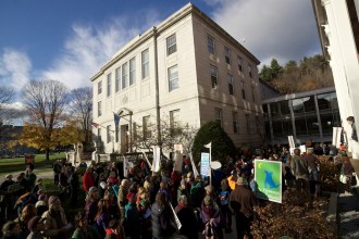 Protesters marched into the Pavilion in Montpelier on Monday to protest the Vermont Gas pipeline.
