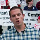 James Haslam, director of the Vermont Workers' Center, speaking to reporters on Monday. VTD/Josh Larkin
