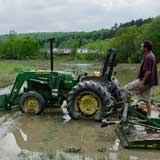 Martin Kemple looks over flooded fields at Foodworks at Two Rivers Farm in Montpelier. VTD/Josh Larkin