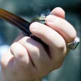 A Vermont resident draws a hit of K2 from a glass pipe. VTD/Josh Larkin