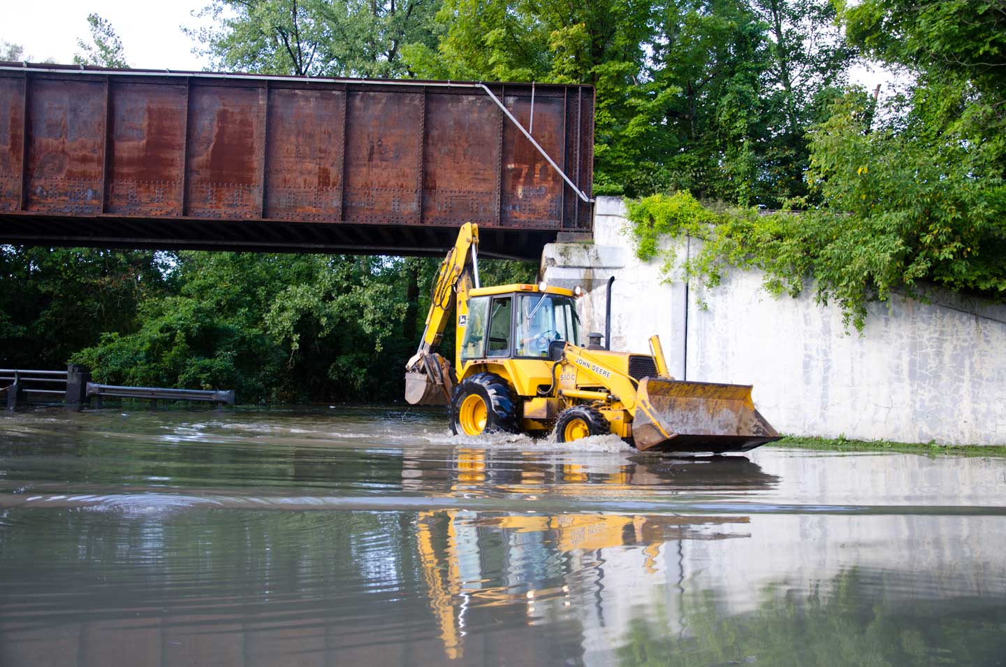 A bucket loader leaves a wake along Route 2 in Waterbury. VTD/Josh Larkin