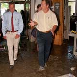 Gov. Peter Shumlin talks to Agency of Agriculture Secretary Chuck Ross while touring the state office complex in Waterbury. VTD/Josh Larkin
