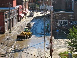 Construction vehicles work to clean up Brattleboro following Tropical Storm Irene.