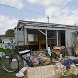 Furnishings lay in mud outside a mobile home in the Weston mobile home park in Berlin. VTD/Josh Larkin