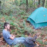A Sterling College student who chose to identify himself as Bumblebee takes a break after climbing to the campsite. Photo by Chris Braithwaite.