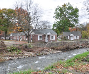 The Whetstone Brook flows beside Melrose Terrace in West Brattleboro. During Tropical Storm Irene on Aug. 28, the brook overflowed its banks and damaged 26 apartments. Photo by Randolph T. Holhut.