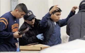 An Immigration and Customs Enforcement officer frisks a migrant worker.