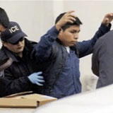 An Immigration and Customs Enforcement officer frisks a migrant worker.