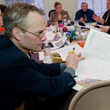 Rep. William Jewett looks over a version of the redistricting map. VTD/Josh Larkin