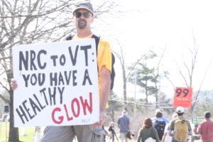 Brad Hartley of Ferrisburg holds a sign protesting Vermont Yankee's continued operation outside Entergy's offices. Photo by Alan Panebaker
