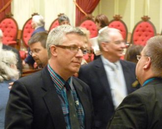 Rep. Tom Stevens, D-Waterbury, talks with Rep. Bob South, R-St. Johnsbury, as lawmakers leave the Statehouse on May 14, 2013. Photo by Anne Galloway/VTDigger