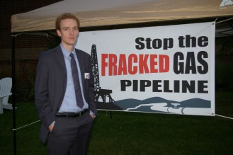 Ben Walsh, an energy advocate with VPIRG, stands outside before a hearing in September 2013. Photo by Andrew Stein/VTDigger