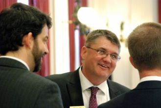 Rep. Don Turner, R-Milton, center, and Rep. Chris Pearson, P-Burlington, share a laugh with House Speaker Shap Smith, right.  Photo by John Herrick