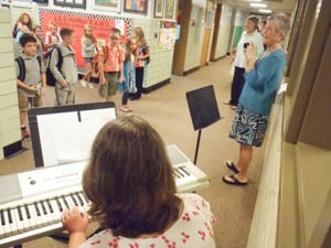 Students are serenaded by teachers as they arrive at Vernon Elementary on Aug. 31. Photo by Mike Faher/VTDigger