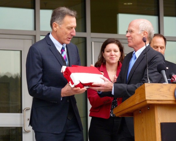 U.S. Rep. Peter Welch, D-Vt., presents Gov. Peter Shumlin with an American flag from the capitol at the opening of the Waterbury state office complex. Photo by Morgan True / VTDigger
