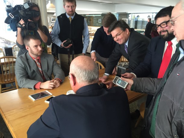 Reporters talk with Sen. Norman McAllister at the Vermont Statehouse. VTDigger Photo by Jasper Craven.