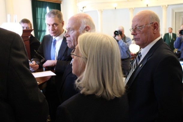 Sen. Norm McAllister, R-Franklin, right, listens as Sens. Peg Flory, Richard Sears and Senate Secretary John Bloomer confer with Lt. Gov. Phil Scott. VTDigger photo by Jasper Craven.