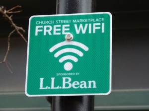 Signs along Church Street advertise it's wireless network. Photo by Morgan True / VTDigger