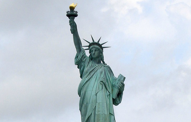 Song aims to shed light on today’s ‘huddled masses’