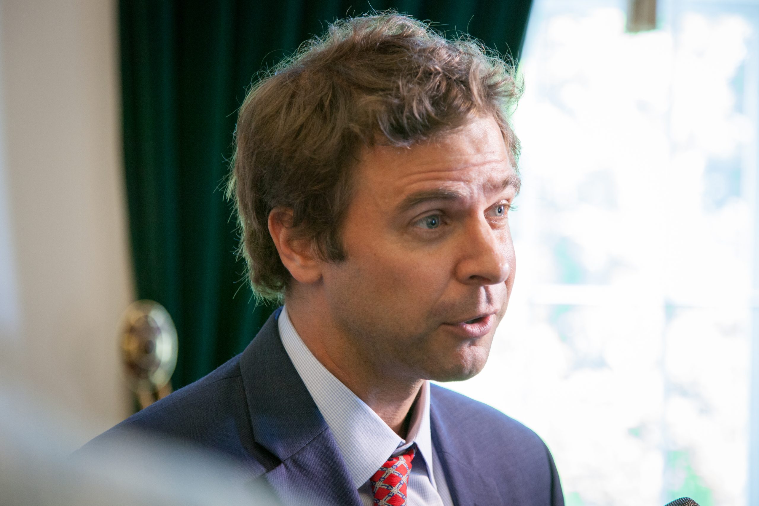 Tim Ashe speaks to reporters