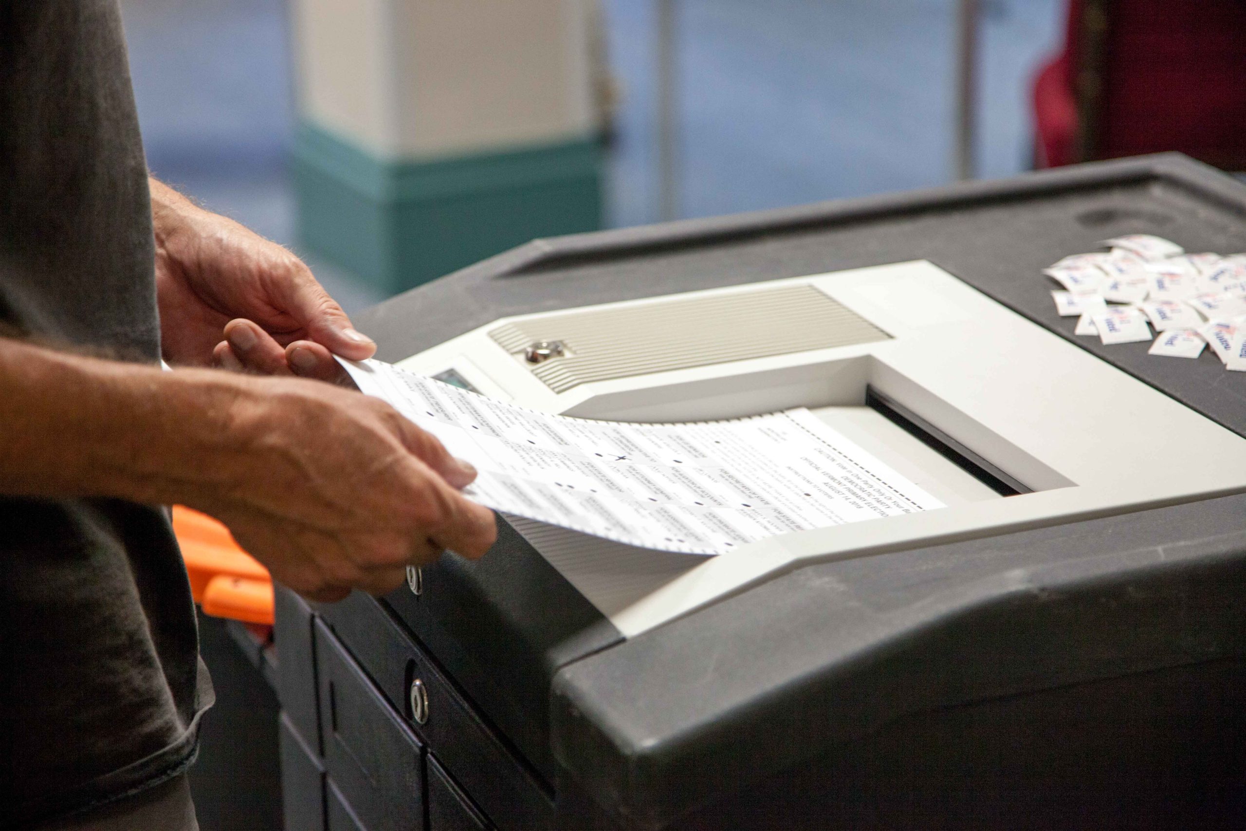 Voter scanning ballot