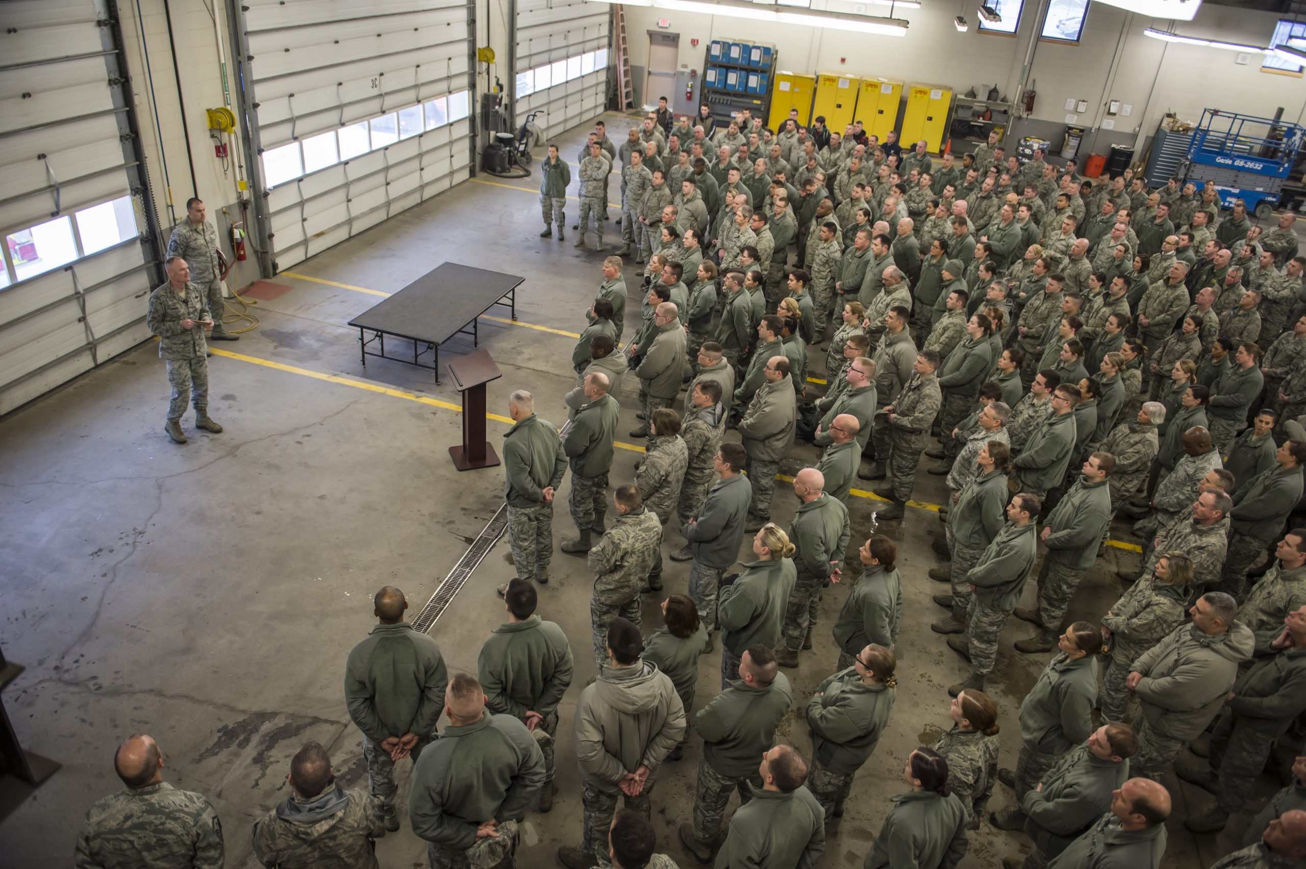Col. Patrick Guinee addresses airmen during a commander’s call