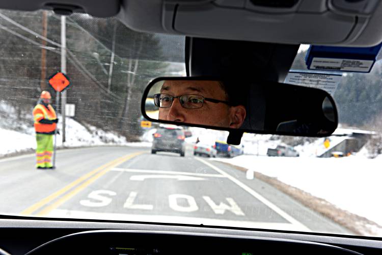 Corey Chase approaches a road construction site