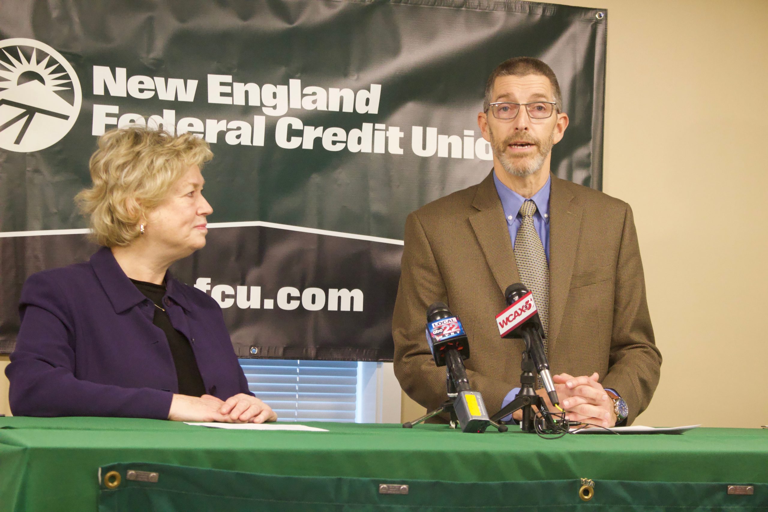 Sarah Carpenter and John Dwyer Jr. announce the credit union's $500,000 gift