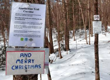 Signs on the AT in Norwich.