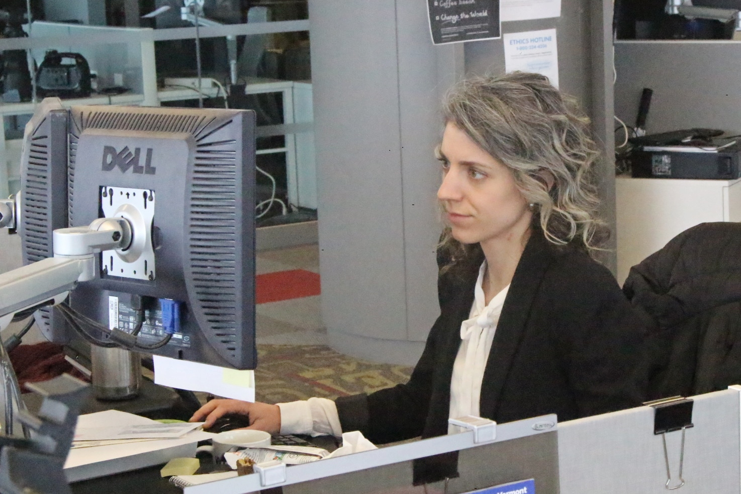 Emilie Stigliani prefers to work at a desk alongside her colleagues, as opposed to having her own office.