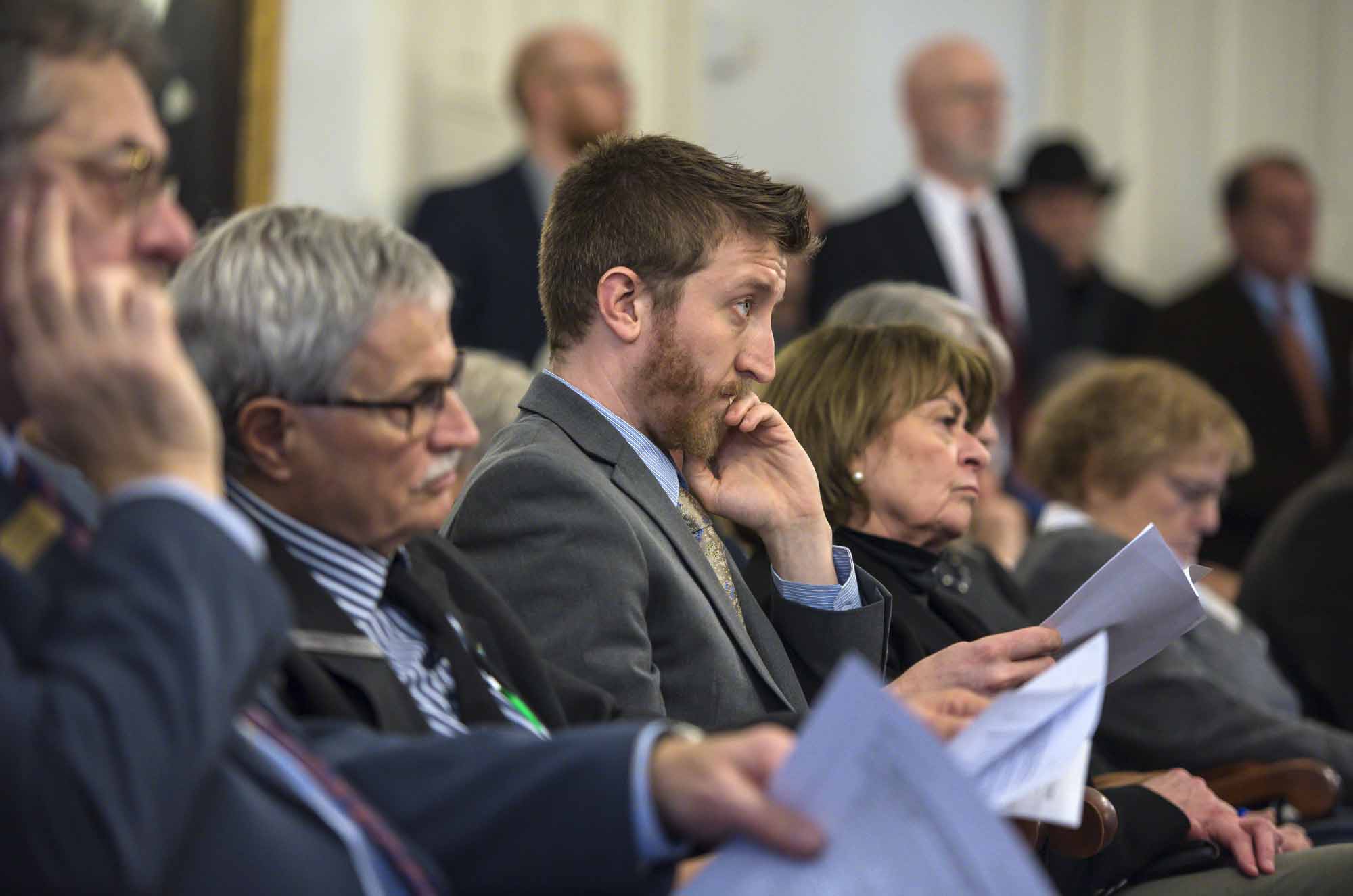 Rep. Logan Nicoll, D-Ludlow, listens as Rep. Heidi Scheuermann, R-Stowe, not seen, explains her proposal.