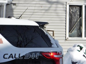 A broken window can be seen at an apartment police raided Thursday at Brattleboro’s 33 Oak St. Photo by Kevin O’Connor/VTDigger