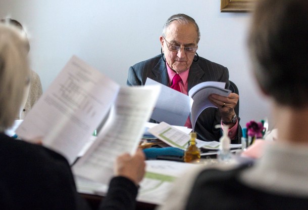 Sen. Dick Mazza, D-Grand Isle, listens as Barb Neal, executive director of the Enhanced 9-1-1 Board, testifies before the Senate Institutions Committee at the Statehouse in Montpelier