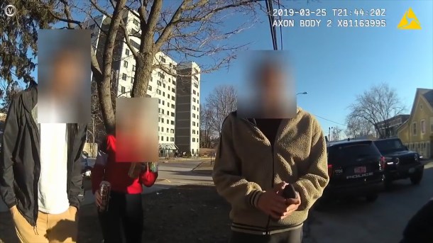 Burlington police body camera video shows Phin Brown, right, speaking with officers. BBD video